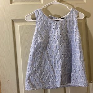 Striped shirt with opening in back